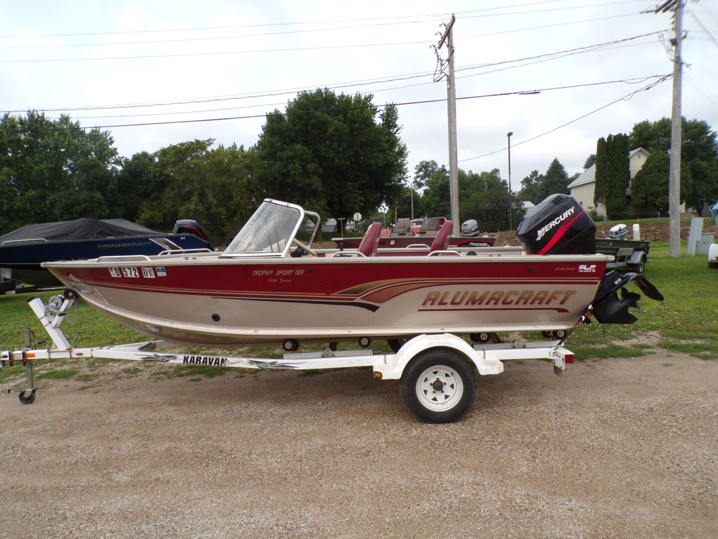 A boat is parked on the side of the road.