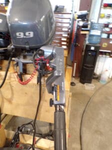 A vise sitting on top of a wooden table.