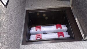 A close up of two boxes in the floor