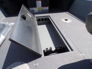 A view of the inside of a boat with its hatch open.