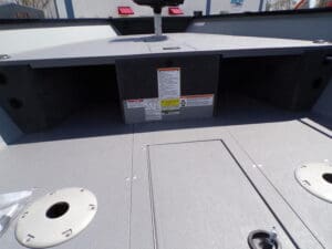 A boat with a large hatch and a box on the side.