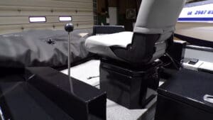 Fishing boat cockpit with white captain's seat