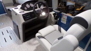 Boat helm with steering wheel and captain's chair