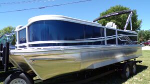 Blue and silver pontoon boat on trailer
