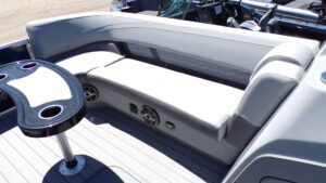 Curved pontoon boat lounge with cupholders