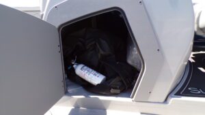 Boat storage compartment with fire extinguisher