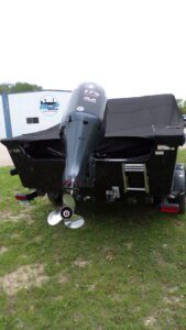 Boat stern with outboard motor and propeller