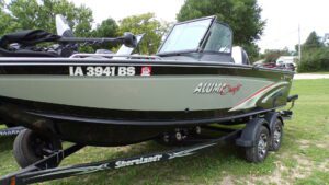 Alumacraft fishing boat on dual-axle trailer