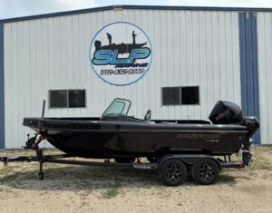 Warrior boat displayed outside building