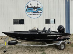 Black Princecraft boat on a silver trailer.