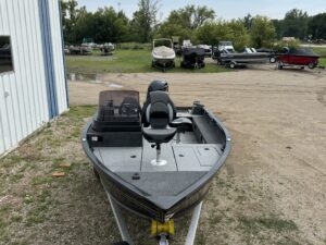 Front view of a fishing boat on display.